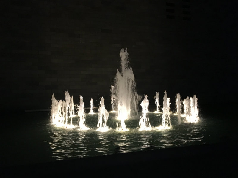 heatwave, water fountain lit by light at NGV