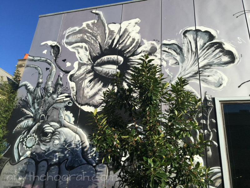 amazing street art of elephant face and flower with greenery in the sunshine