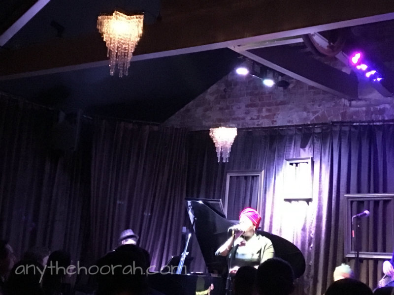 thando singing at the paris cat under the chandeliers