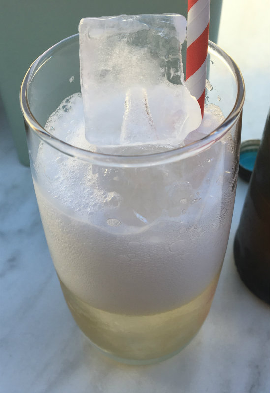 effervescent drink on ice with paper straw