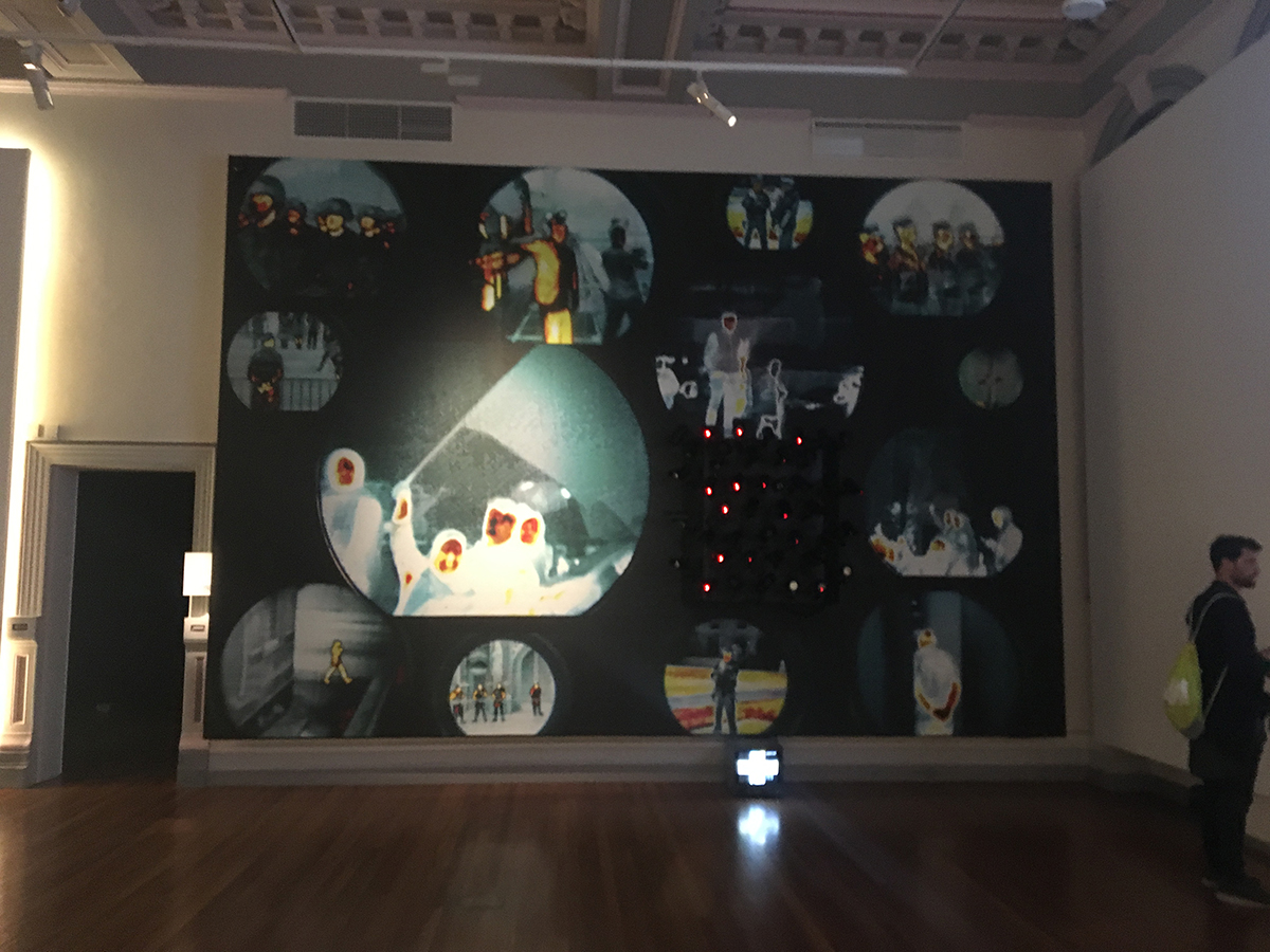 surveillance images and cameras on huge canvas in model citizens exhibition