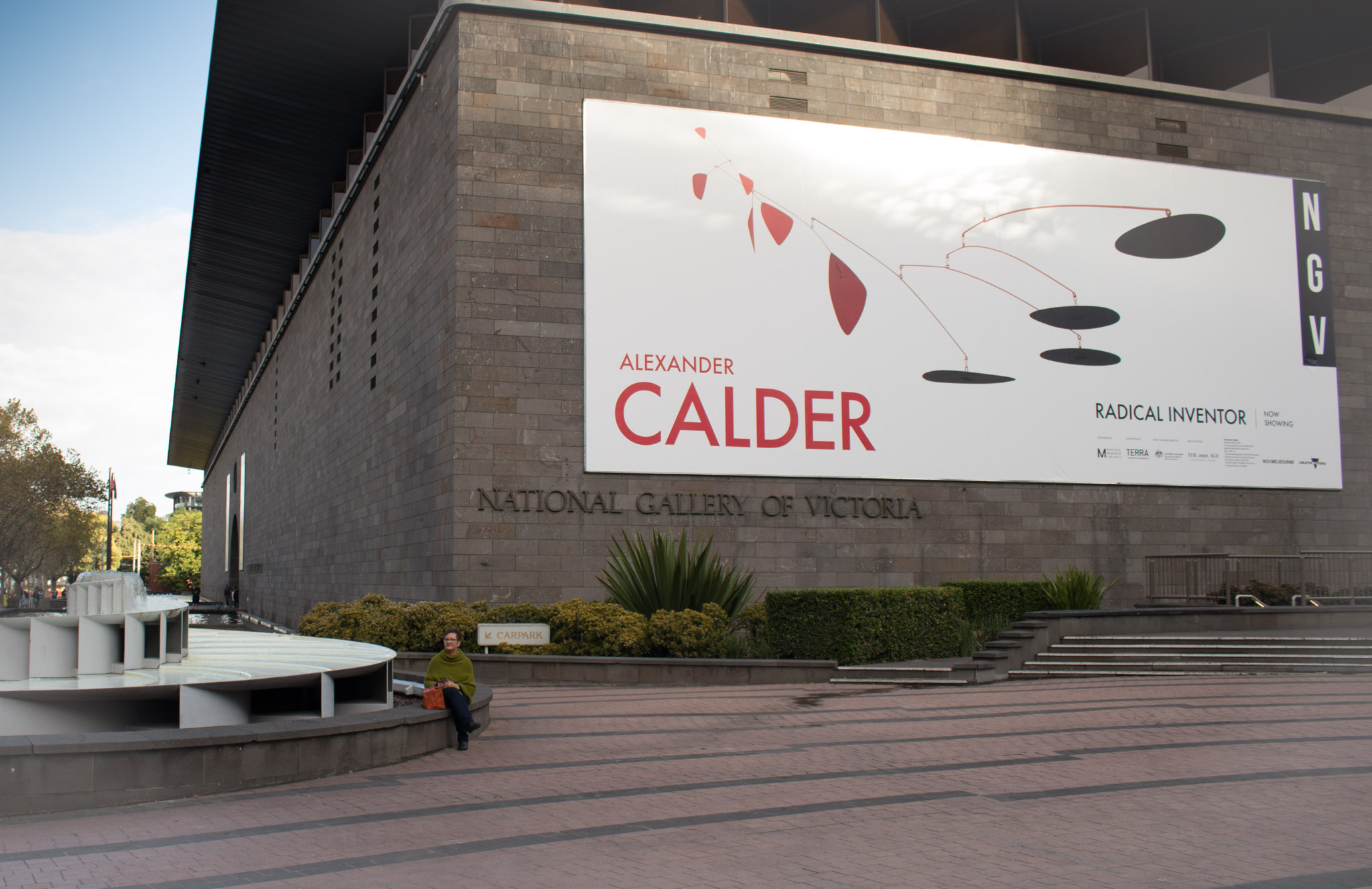 wideshot view of NGV with Calder poster