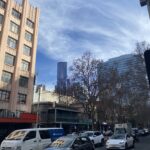 view to the city from a bourke street tram stop